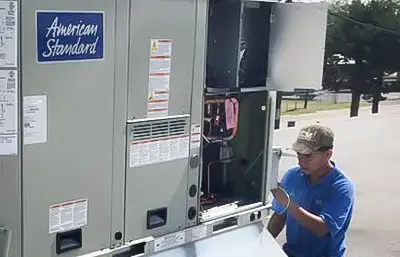 Hard at work repairing an air conditioner in Gainesville TX